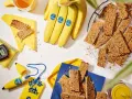 Barrette energetiche e banane Chiquita, perfette come snack banana prima o dopo allenamento. Cronometro e power bank a tema.