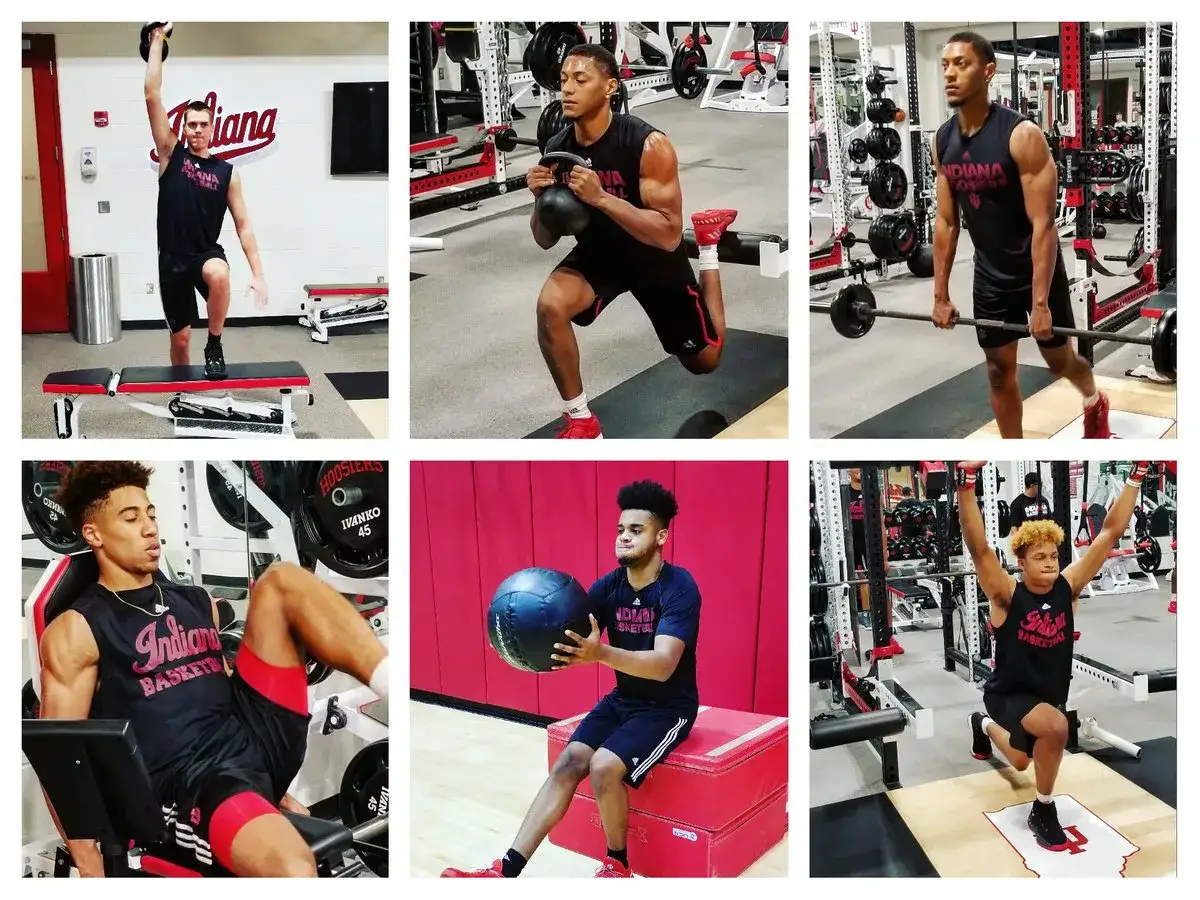 Atleti eseguono esercizi di rinforzo muscolare arti inferiori in palestra: squat con kettlebell, stacchi da terra, leg press e affondi.
